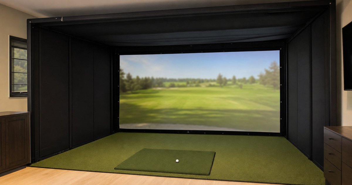 A full golf hitting bay with an enclosure, impact screen and mat.