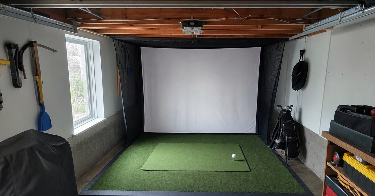 A golf simulator hitting bay built into a residential garage.